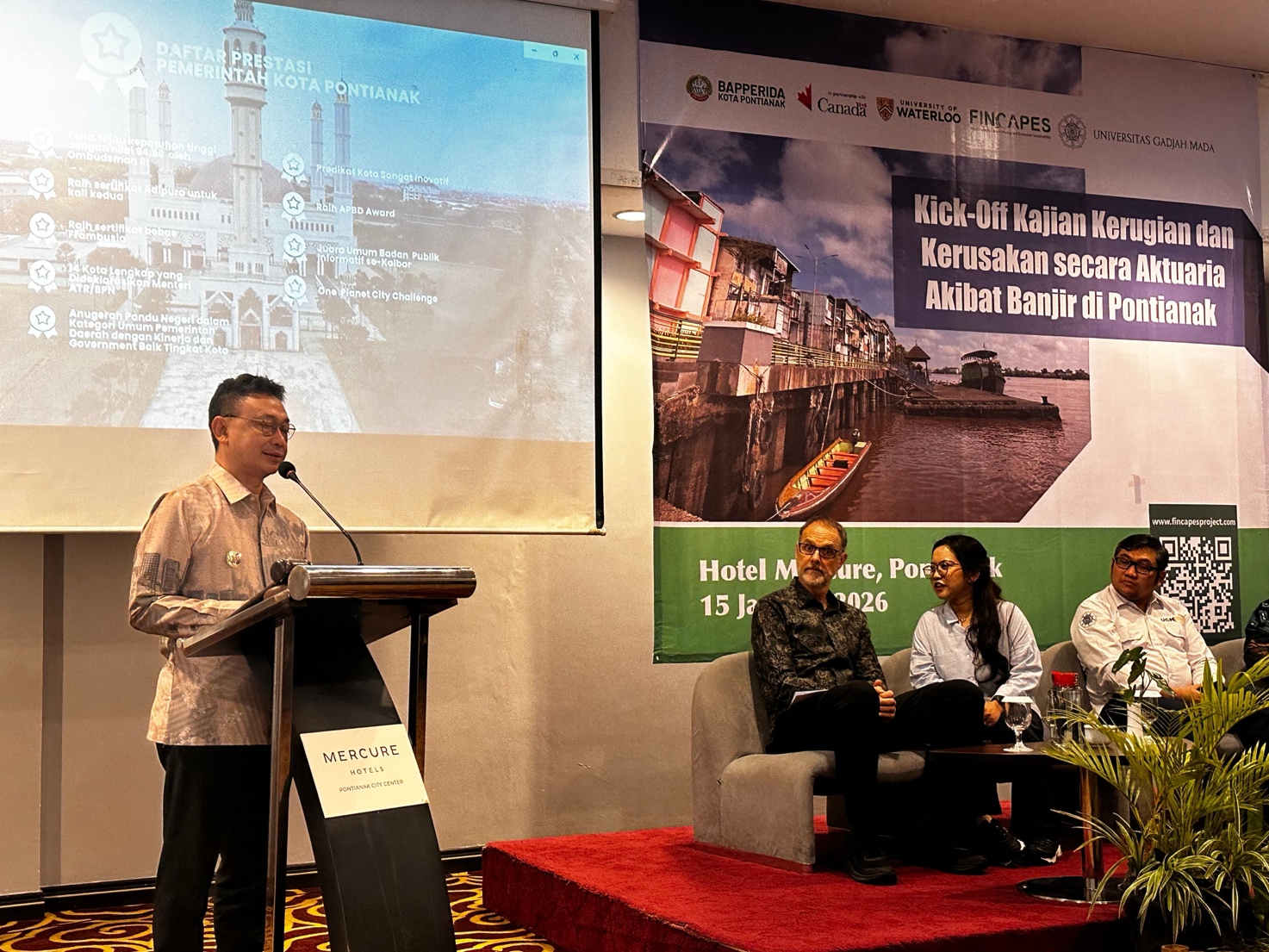 A person standing at a podium with a microphone

AI-generated content may be incorrect.